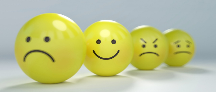 4 smiley faces showing different emotions