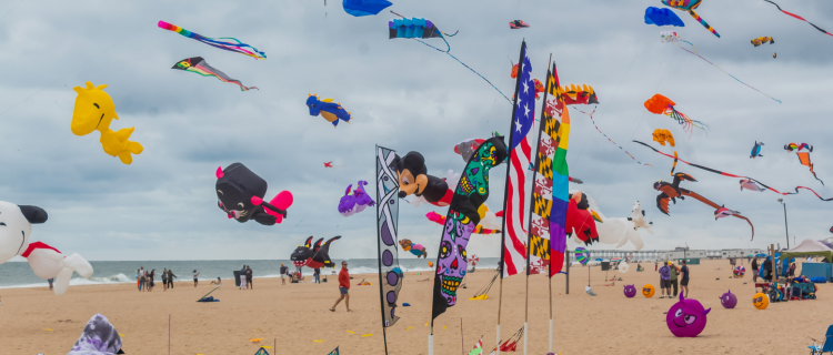 Beach scene with lots of kites, flags and disney blow ups: Could Your Pension Tax-Free Cash Be About to Change